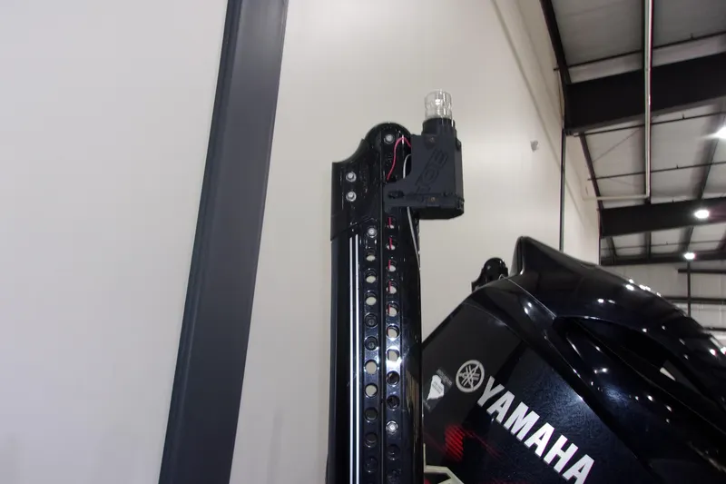 Slide: The Image of 2020 Skeeter FXR21 Limited boat with Yamaha engine in a warehouse setting. - 4