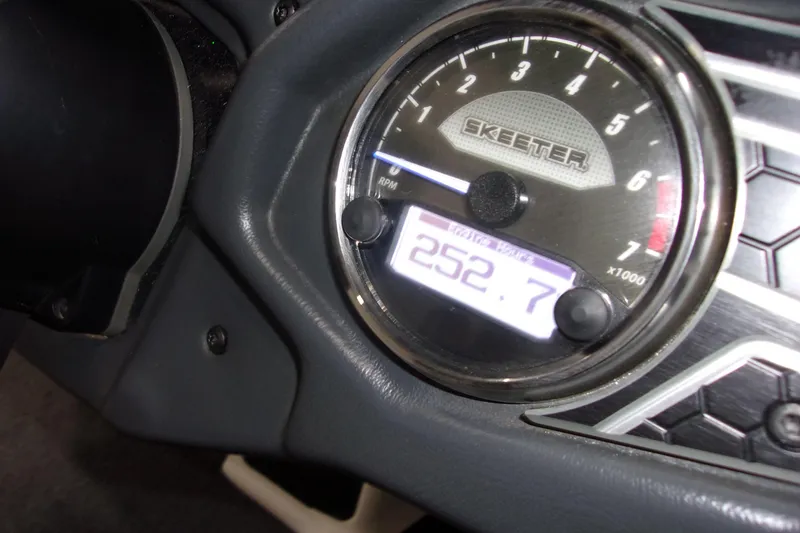 Slide: The Image of 2020 Skeeter FXR21 Limited dashboard with tachometer displaying 252.7 hours. - 9