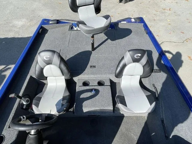 Slide: The Image of 2023 Crestliner XFC 179 boat interior with three seats and steering wheel. - 13