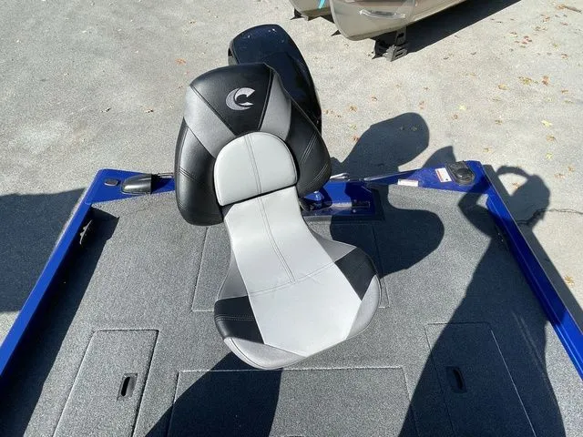 Slide: The Image of 2023 Crestliner XFC 179 boat seat, black and gray design, on a textured deck. - 14