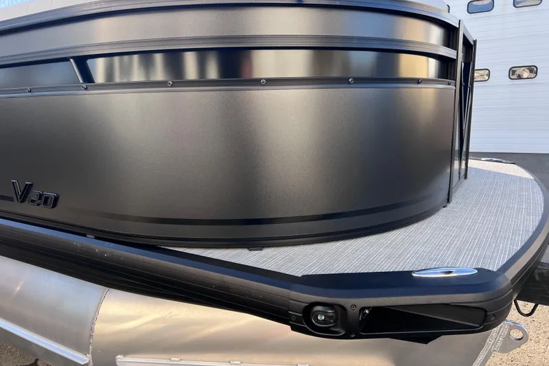 Slide: The Image of 2026 Viaggio V 20U pontoon boat with sleek black exterior design. - 24