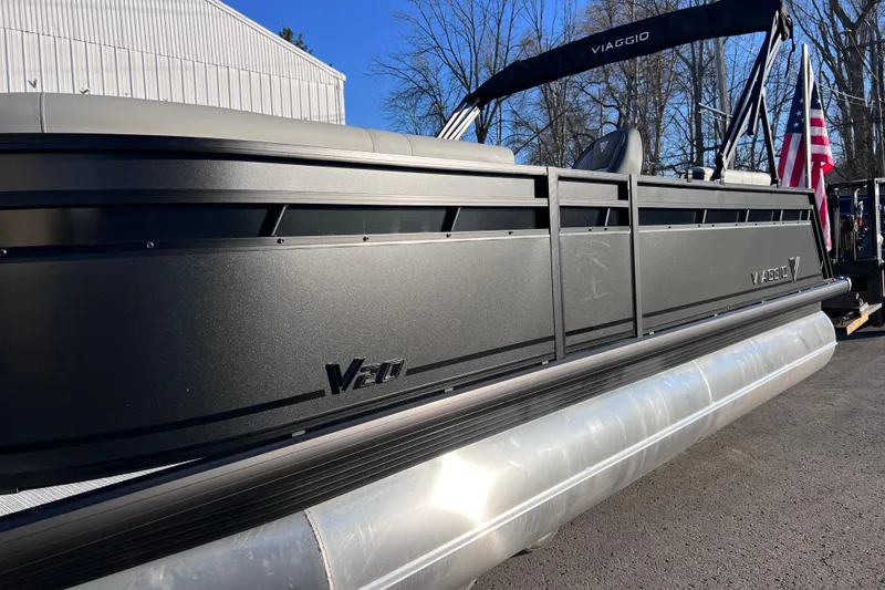 Slide: The Image of 2026 Viaggio V 20U pontoon boat with sleek black design and American flag. - 27