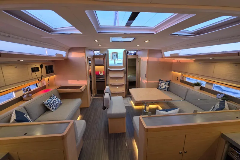 Slide: The Image of Luxurious interior of 2024 Dufour 530 yacht with modern seating and skylights. - 10
