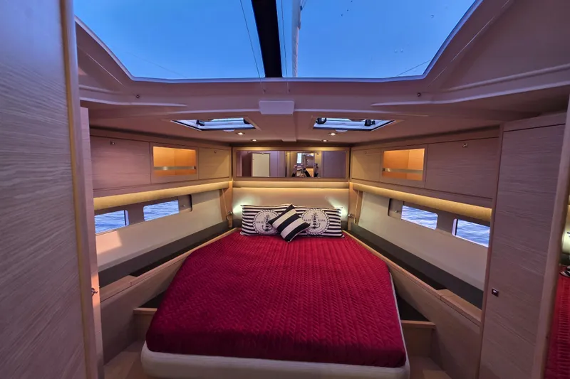 Slide: The Image of Luxurious interior of 2024 Dufour 530 yacht with cozy bed and elegant design. - 15