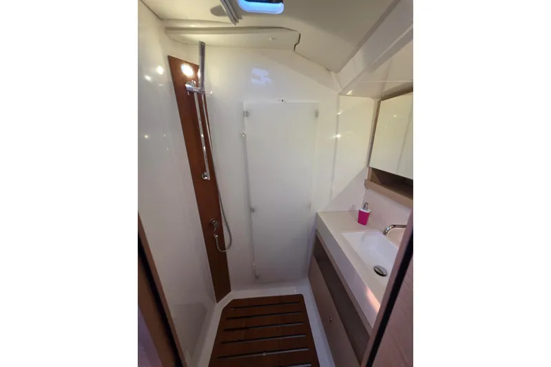 Slide: The Image of 2024 Dufour 530 yacht bathroom with modern shower and sink area. - 21