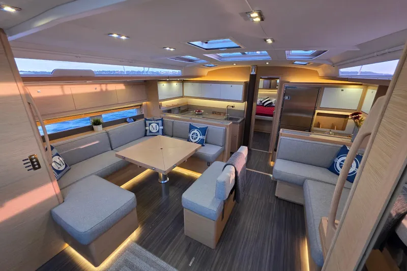 Slide: The Image of Luxurious interior of 2024 Dufour 530 yacht with modern seating and elegant design. - 7