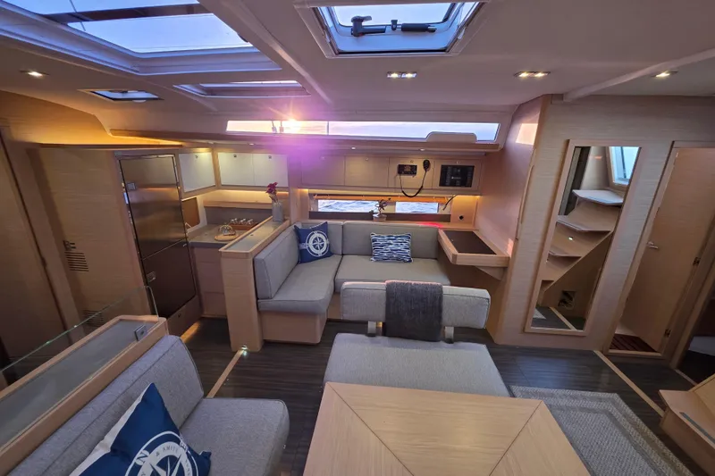 Slide: The Image of Luxurious interior of 2024 Dufour 530 yacht, featuring modern design and spacious seating. - 8