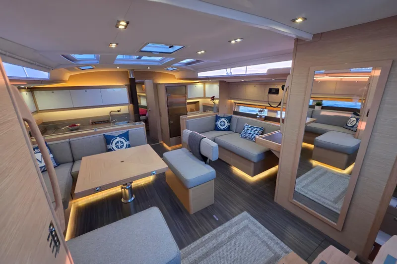 Slide: The Image of Luxurious interior of 2024 Dufour 530 yacht with modern furnishings and ambient lighting. - 9