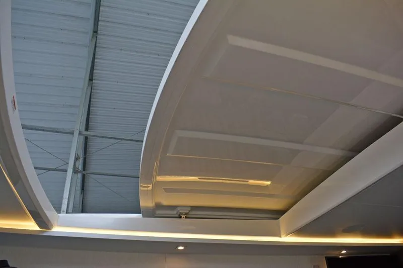 Slide: The Image of 2017 Sea Ray Sundancer 460 yacht docked in a covered marina. - 44