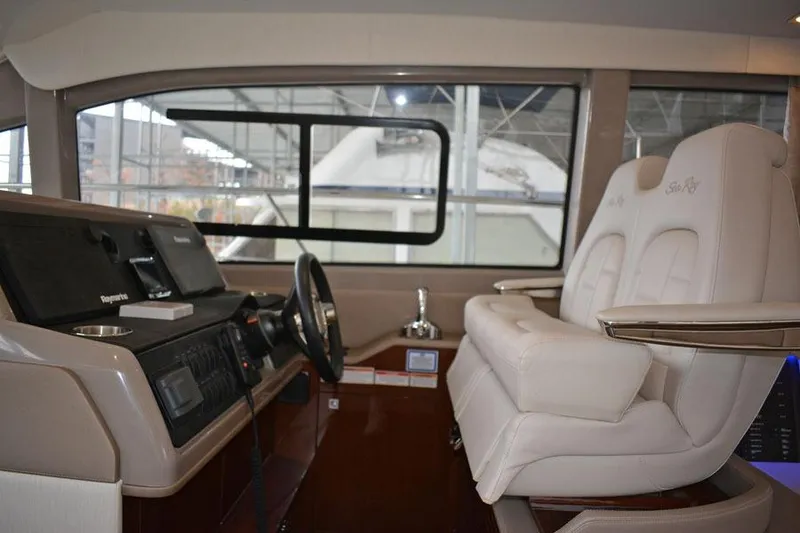 Slide: The Image of Engine room of 2017 Sea Ray Sundancer 460 yacht, showcasing mechanical components and wiring. - 48