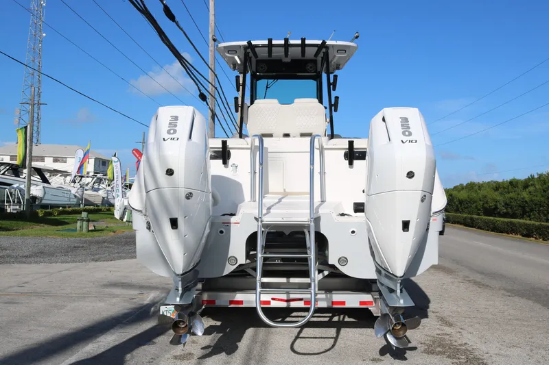 Slide: The Image of 2024 World Cat 325 CC boat with dual 350 V10 engines, rear view. - 4