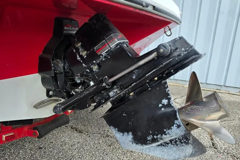 Slide: The Image of 1991 Rinker 236 Captiva Cuddy Cabin boat with MerCruiser outdrive and propeller. - 13