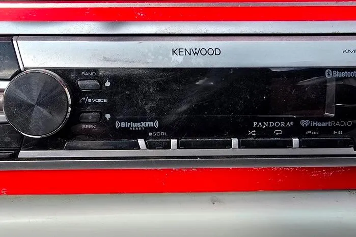 Slide: The Image of Kenwood stereo system in a 1991 Rinker 236 Captiva Cuddy Cabin boat. - 18