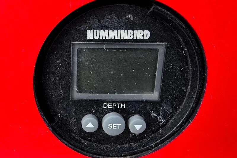 Slide: The Image of Humminbird depth gauge on 1991 Rinker 236 Captiva Cuddy Cabin boat dashboard. - 19