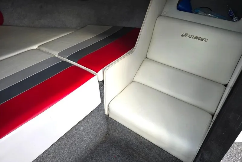 Slide: The Image of 1991 Rinker 236 Captiva Cuddy Cabin interior with red, gray, and white upholstery. - 7