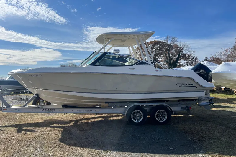 The Image of 2021 Boston Whaler 240 Vantage boat on trailer under clear sky. - 0