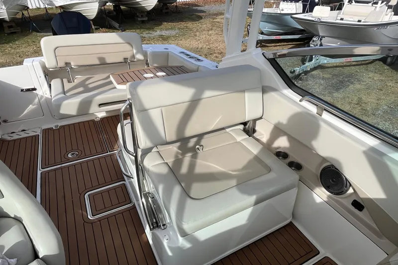 Slide: The Image of Control panel of a 2021 Boston Whaler 240 Vantage boat with Lenco trim tabs. - 16