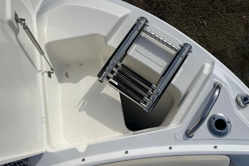 Slide: The Image of 2021 Boston Whaler 240 Vantage interior with plush seating and modern dashboard. - 22