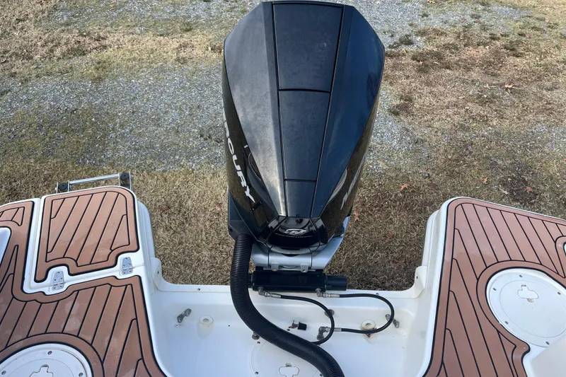 Slide: The Image of 2021 Boston Whaler 240 Vantage boat with stainless steel ladder and storage compartment. - 25