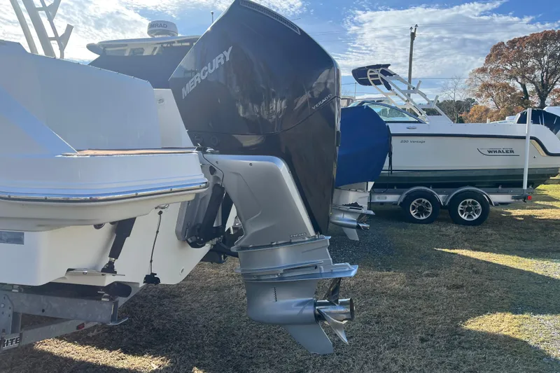 Slide: The Image of Boston Whaler 240 Vantage 2021 cruising with Mercury engine on a sunny day. - 4