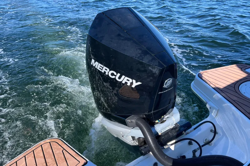 Slide: The Image of Boston Whaler 240 Vantage 2021 with Mercury outboard engine on water. - 42