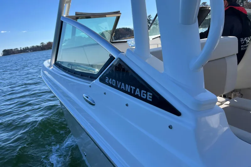 Slide: The Image of 2021 Boston Whaler 240 Vantage boat cruising on a sunny day. - 44