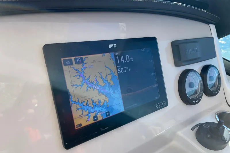Slide: The Image of Dashboard of a 2021 Boston Whaler 240 Vantage with navigation display and gauges. - 46
