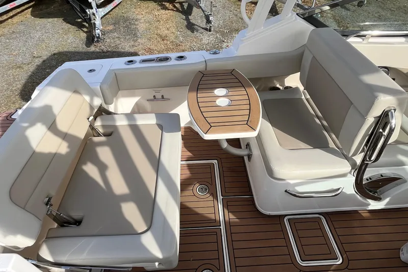 Slide: The Image of 2021 Boston Whaler 240 Vantage helm with steering wheel and control panel. - 6