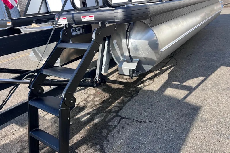 Slide: The Image of 2026 Viaggio V 20U pontoon boat with black ladder on concrete surface. - 26