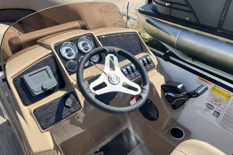 Slide: The Image of 2026 Sylvan Mirage Fish 820 Party Fish boat dashboard with steering wheel and controls. - 15