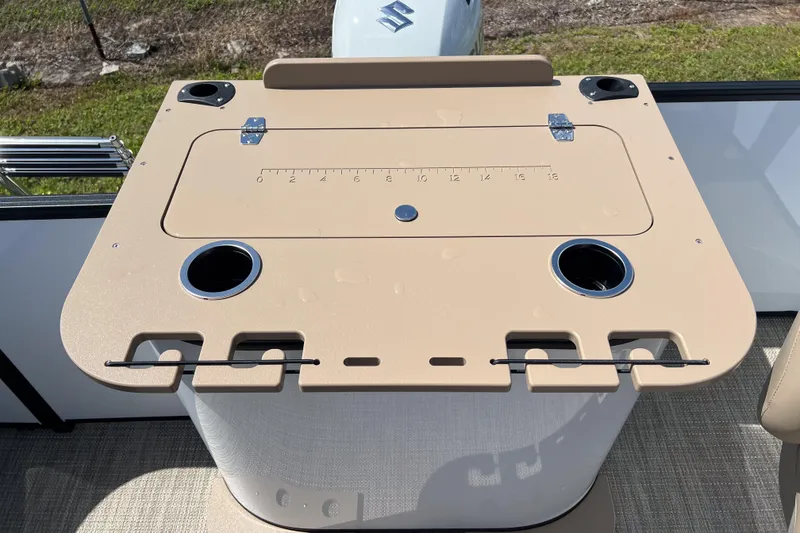 Slide: The Image of Fishing station on 2026 Sylvan Mirage Fish 820 Party Fish boat, featuring cup holders and measuring board. - 21