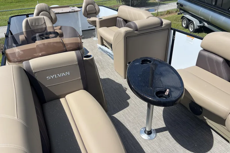 Slide: The Image of 2026 Sylvan Mirage Fish 820 Party Fish pontoon boat interior with seating and table. - 7