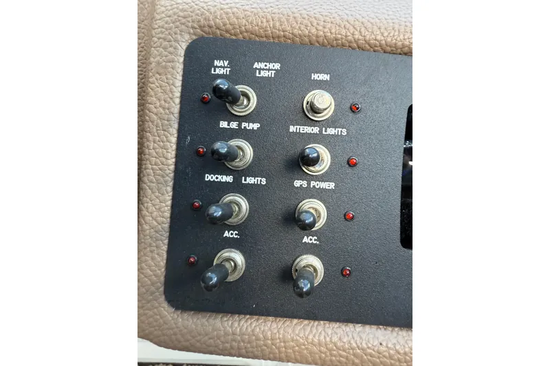 Slide: The Image of Control panel of a 2015 Cobalt 200 boat with various switches and indicators. - 14