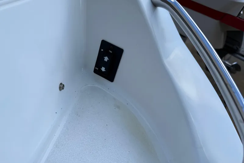 Slide: The Image of Trim control panel on a 2015 Cobalt 200 boat, featuring up and down arrows. - 22