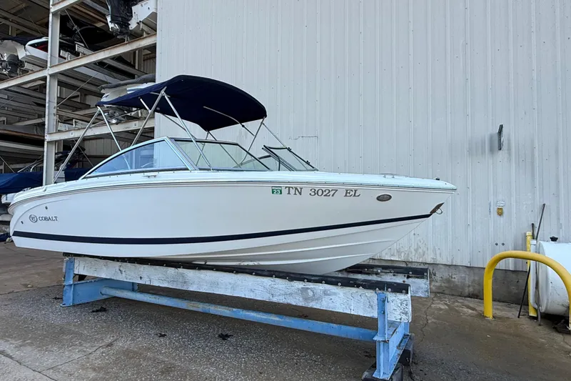 Slide: The Image of 2015 Cobalt 200 boat in storage, marina background, clear sky. - 4