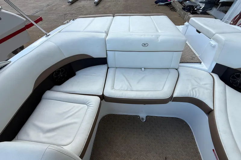 Slide: The Image of Cobalt 200 boat interior, 2015 model, featuring white cushioned seating and storage compartments. - 8