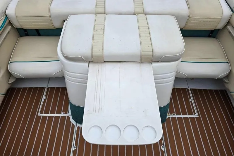 Slide: The Image of Interior of a 1995 Sea Ray 240 Bow Rider boat with seating area. - 10