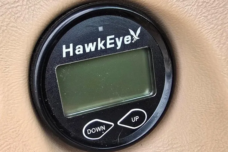 Slide: The Image of HawkEye display on 1995 Sea Ray 240 Bow Rider dashboard, featuring up and down buttons. - 22