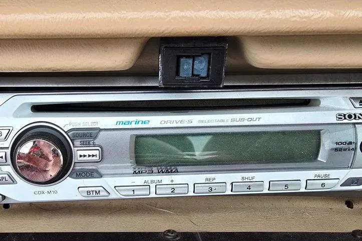 Slide: The Image of Sony marine stereo system in a 1995 Sea Ray 240 Bow Rider boat dashboard. - 23