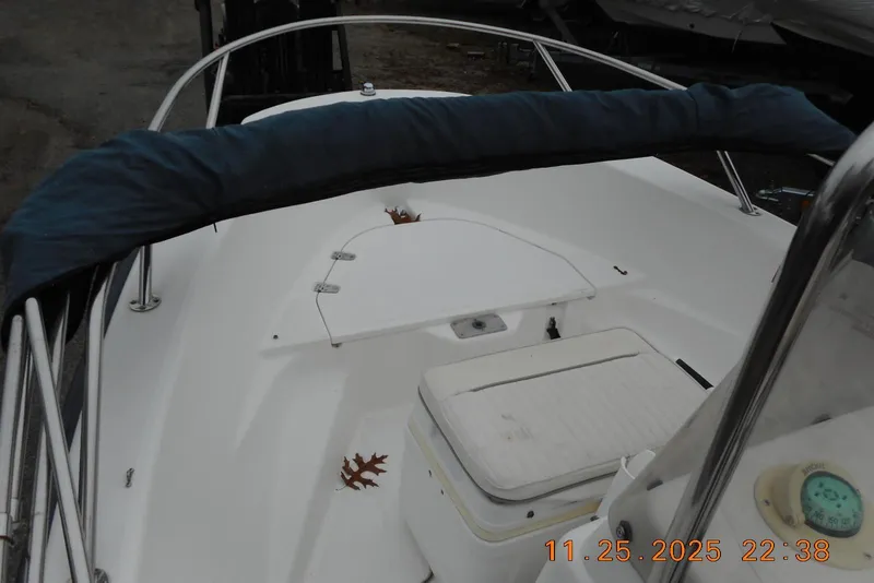 Slide: The Image of 2001 Boston Whaler 16 Dauntless boat interior with seating and storage compartments. - 4