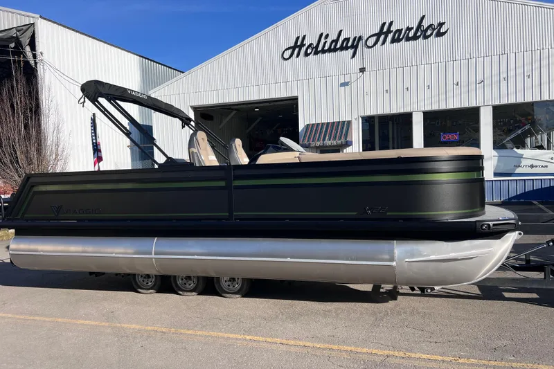 The Image of 2026 Viaggio X 22S Tritoon boat parked at Holiday Harbor marina. - 0