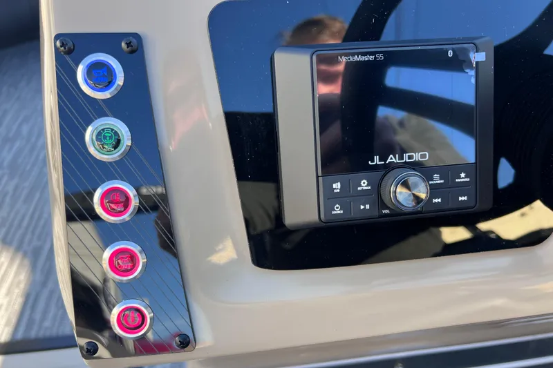 Slide: The Image of Control panel of 2026 Viaggio X 22S Tritoon with JL Audio system and illuminated buttons. - 10