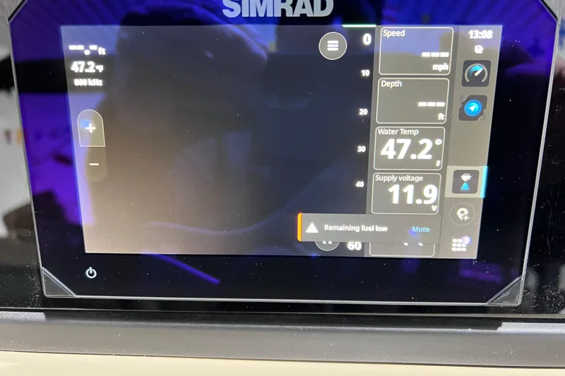 Slide: The Image of Simrad display on 2026 Viaggio X 22S Tritoon showing speed, depth, water temperature, and voltage. - 14