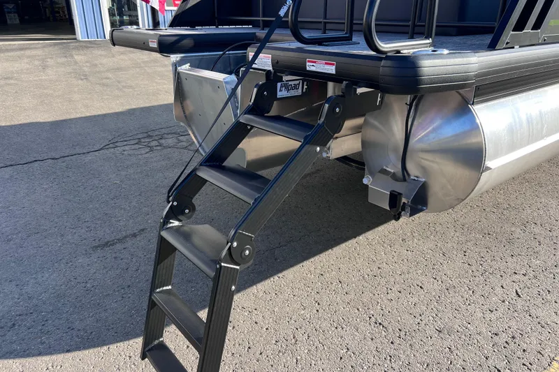 Slide: The Image of 2026 Viaggio X 22S Tritoon with foldable boarding ladder on a sunny day. - 15