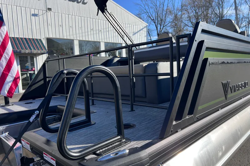 Slide: The Image of 2026 Viaggio X 22S Tritoon boat with sleek design and American flag. - 17