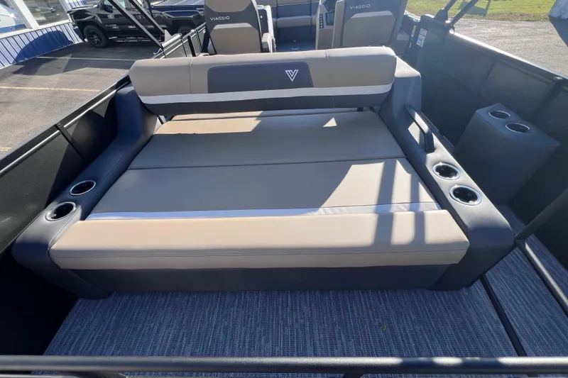 Slide: The Image of 2026 Viaggio X 22S Tritoon boat interior with comfortable seating and cup holders. - 19