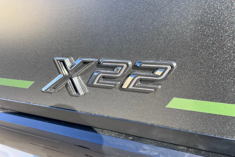 Slide: The Image of 2026 Viaggio X 22S Tritoon logo on metallic surface with green accents. - 3