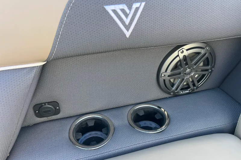 Slide: The Image of 2026 Viaggio X 22S Tritoon interior with speaker, cup holders, and logo detail. - 39