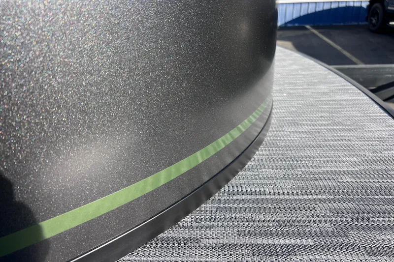 Slide: The Image of Close-up of 2026 Viaggio X 22S Tritoon with metallic finish and green accent. - 4