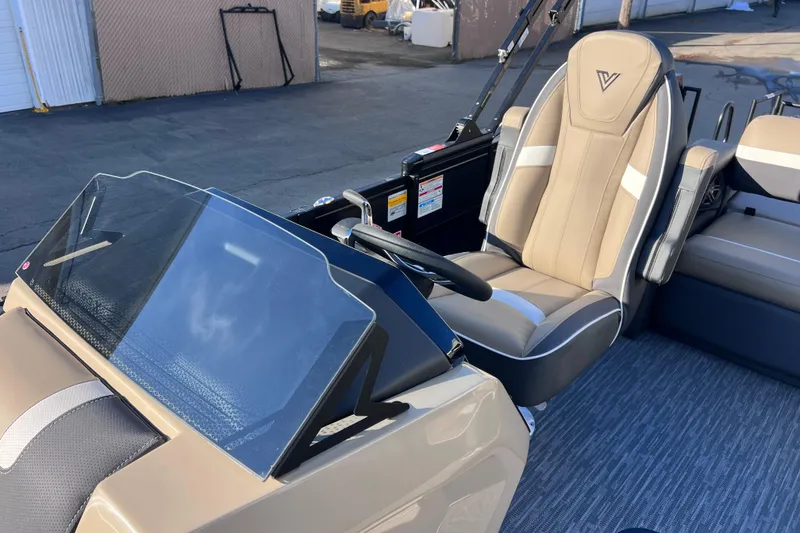 Slide: The Image of 2026 Viaggio X 22S Tritoon interior with modern helm and comfortable seating. - 9